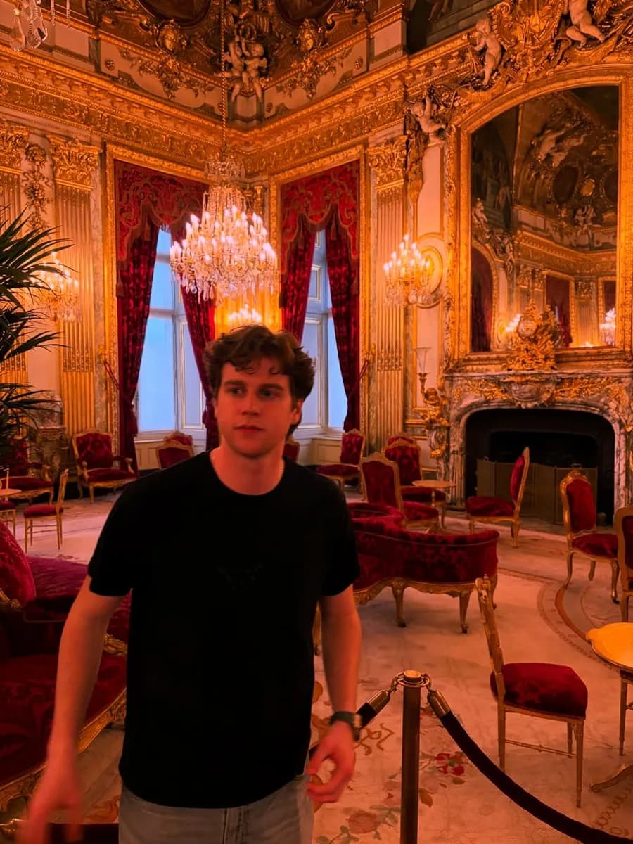 Andy in a gilded room at the Louvre in Paris