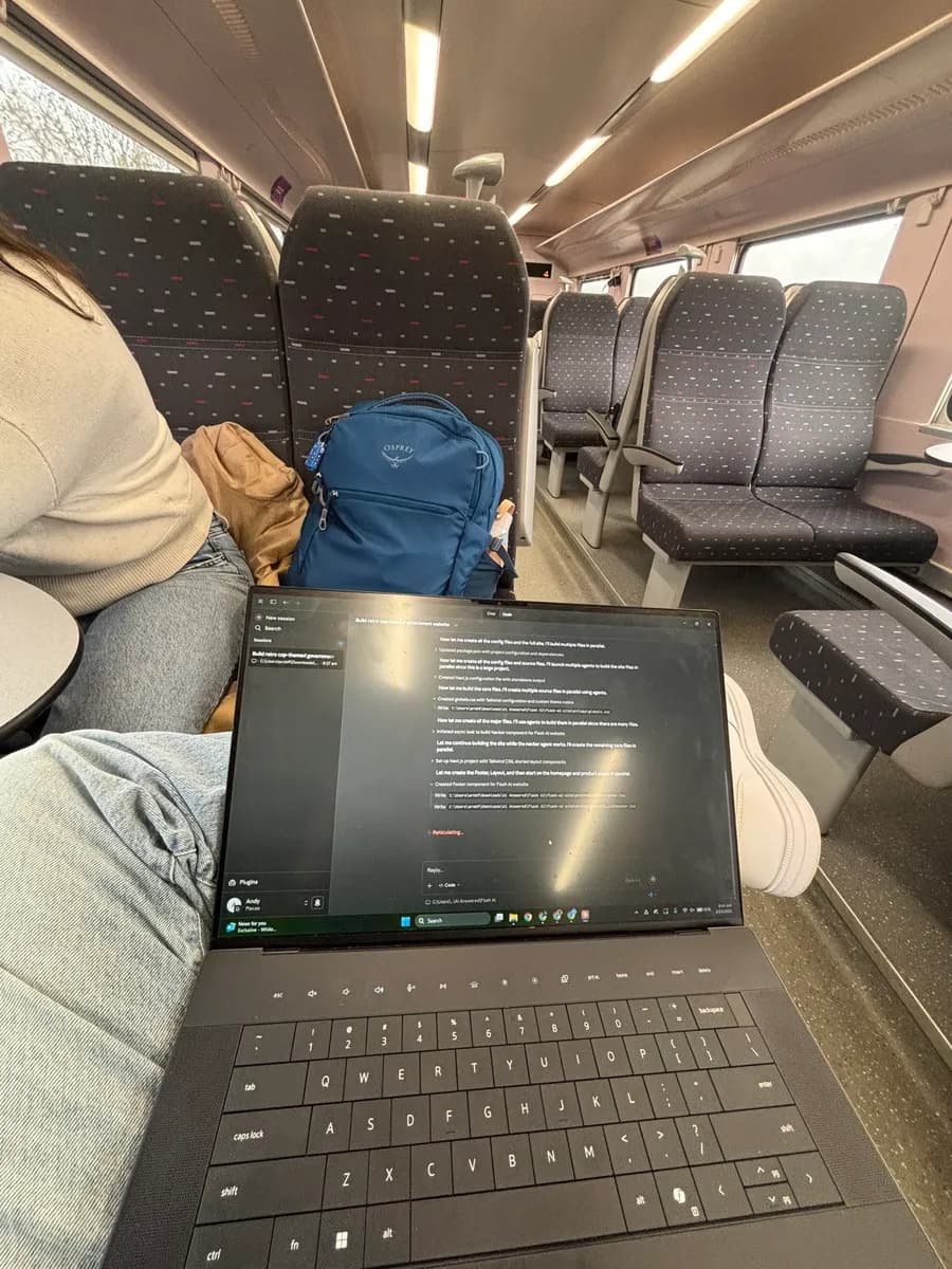 A laptop open on a European train